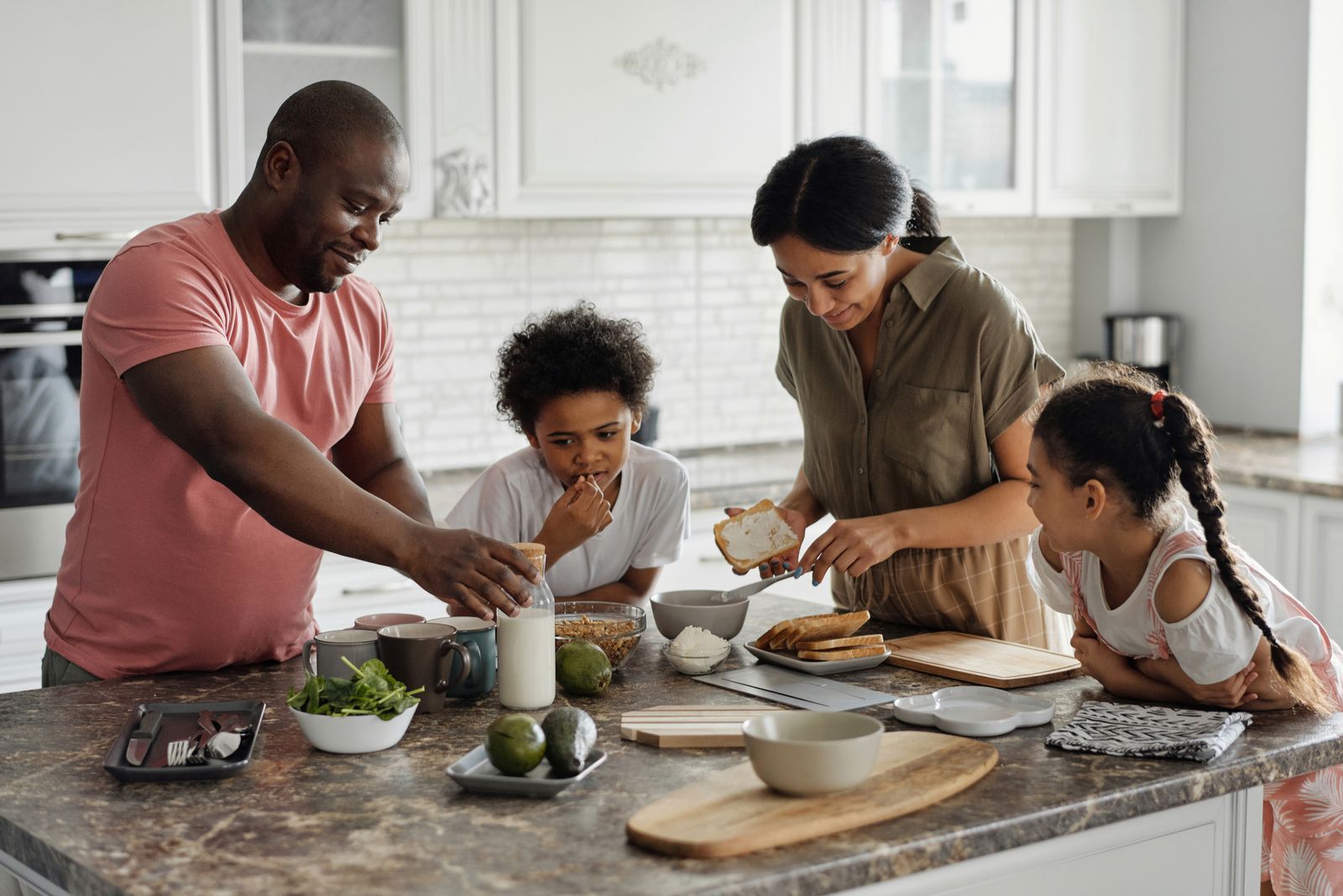 Family preparing a meal together at home